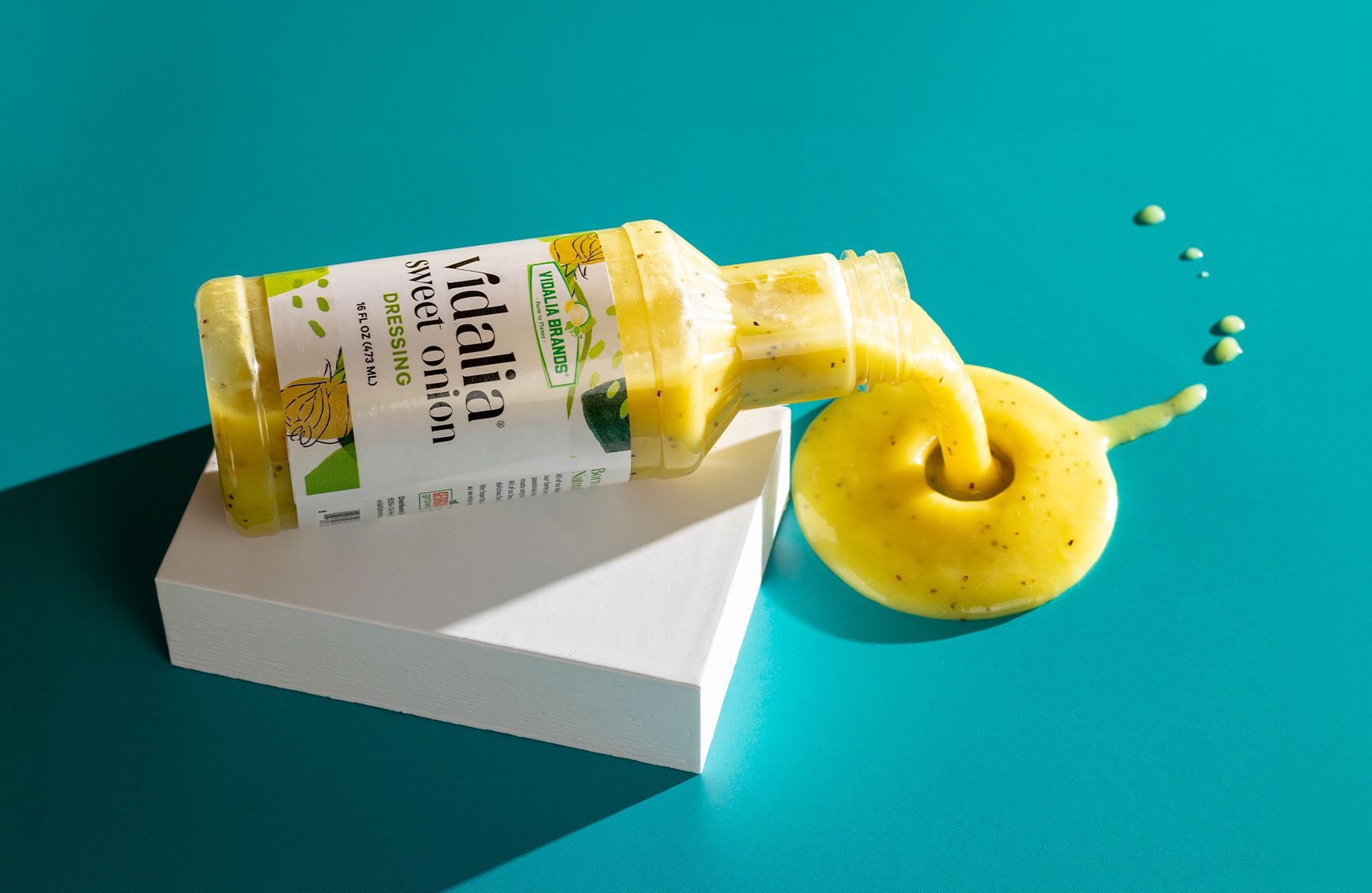 Vidalia Brands bottle spilling savory sauce on the table.